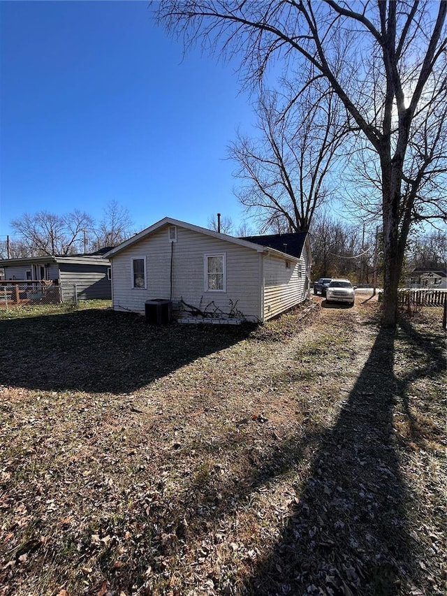 view of side of property featuring central AC unit