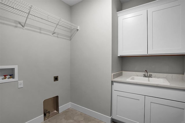 laundry area with cabinets, washer hookup, electric dryer hookup, and sink