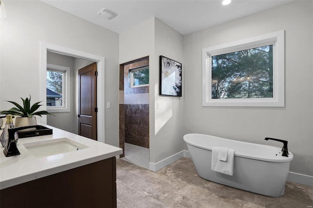 bathroom featuring shower with separate bathtub and vanity