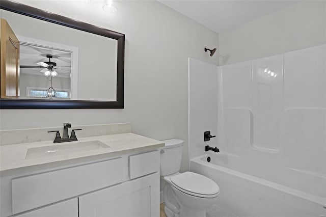 full bathroom featuring bathing tub / shower combination, ceiling fan, vanity, and toilet