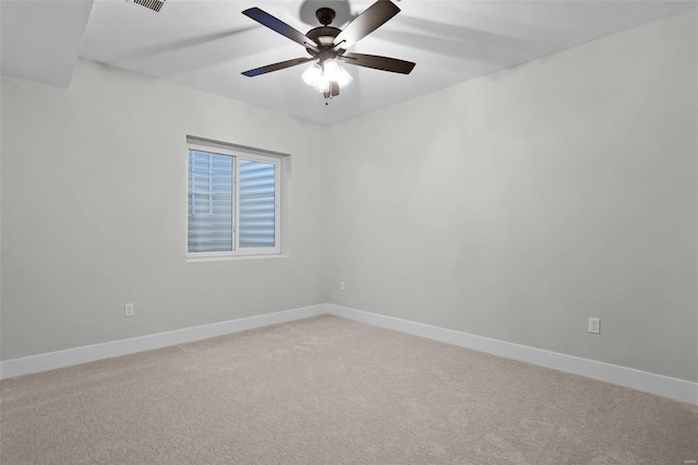 empty room featuring carpet floors and ceiling fan