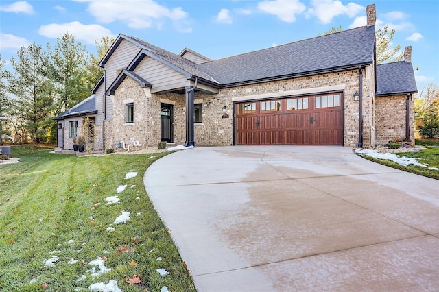 view of front facade featuring a garage and a front lawn