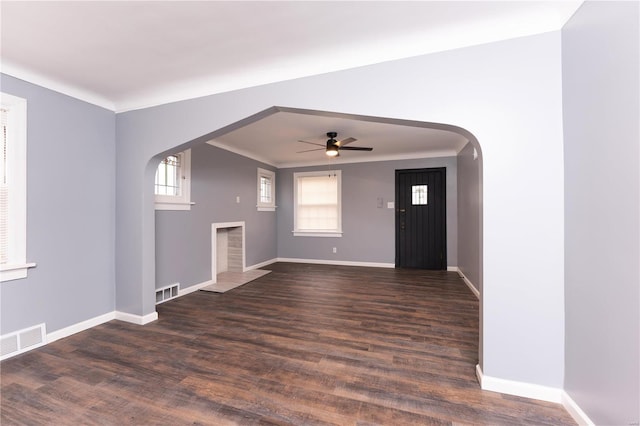 entrance foyer with ceiling fan and dark wood-type flooring