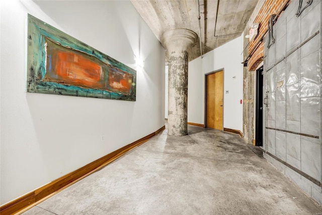 hall with concrete floors