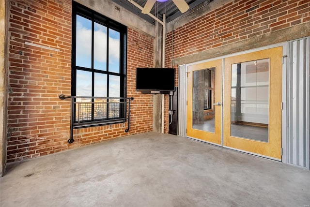 view of patio with ceiling fan and french doors