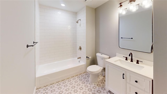 full bathroom featuring vanity, toilet, and tiled shower / bath