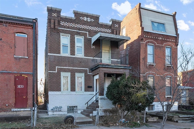 view of front of home with a balcony