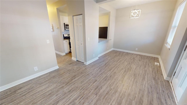 unfurnished room featuring light hardwood / wood-style floors