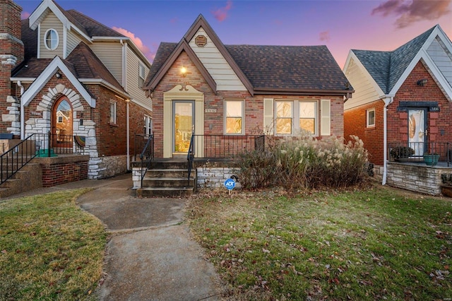 view of front of home with a lawn