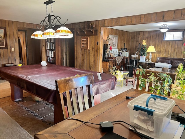 dining area featuring billiards and wooden walls