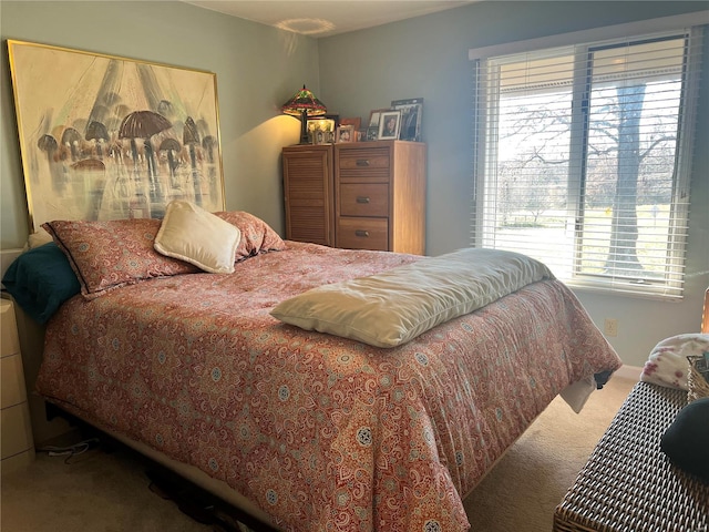 carpeted bedroom featuring multiple windows