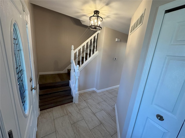 entrance foyer with a chandelier