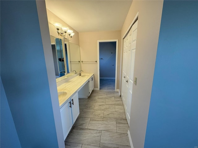 bathroom featuring a chandelier and vanity