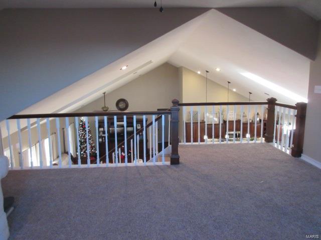 bonus room featuring ceiling fan, carpet floors, and lofted ceiling