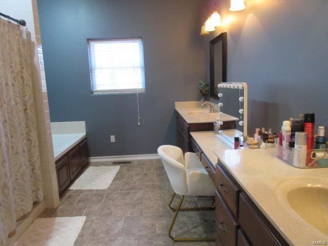 bathroom featuring vanity and shower with separate bathtub