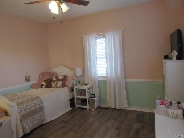 bedroom featuring ceiling fan and dark hardwood / wood-style floors