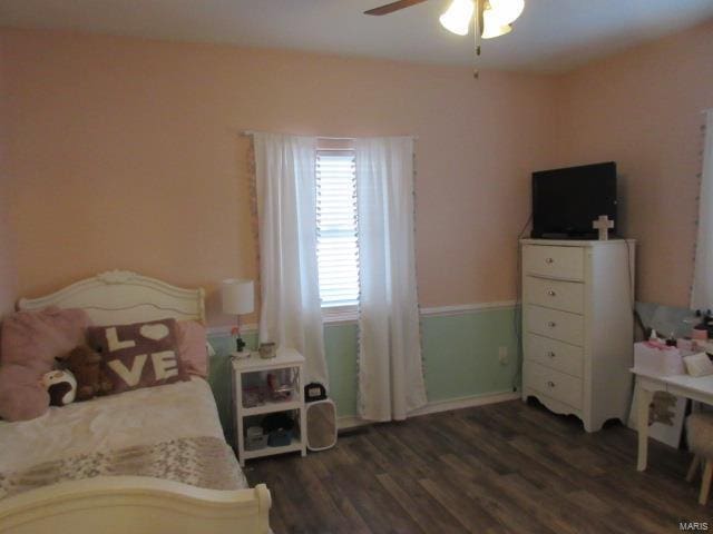 bedroom featuring dark hardwood / wood-style floors and ceiling fan