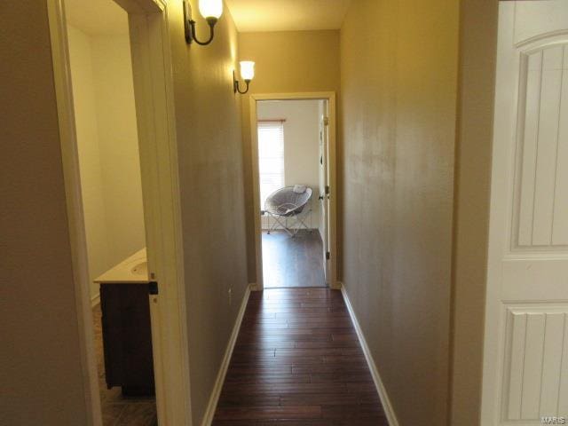 corridor with dark wood-type flooring