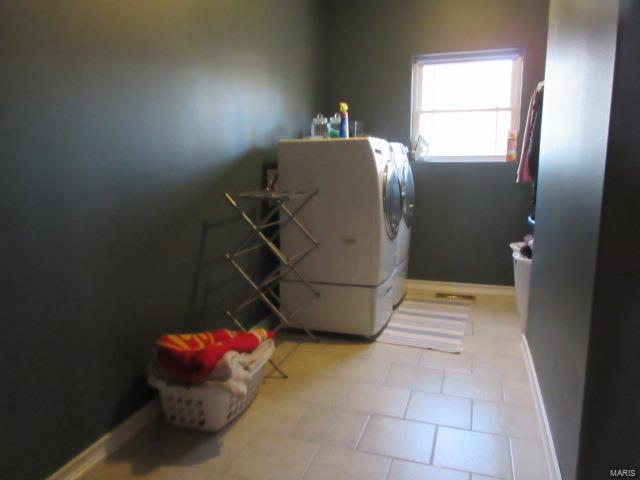 laundry area featuring independent washer and dryer