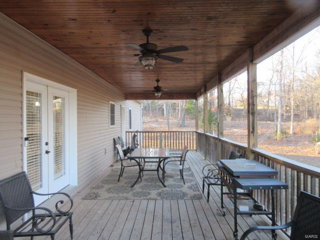 deck featuring french doors and ceiling fan