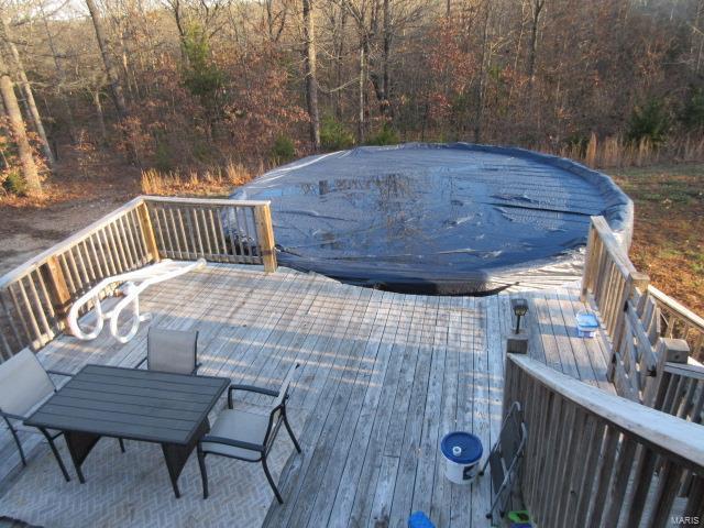 deck with a covered pool