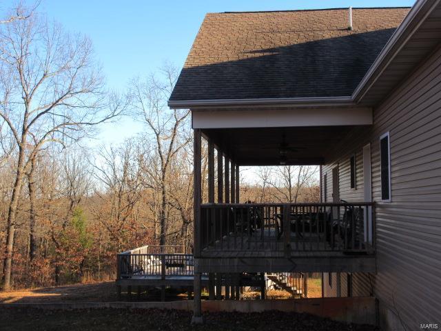 wooden deck with ceiling fan