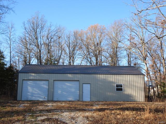 view of outdoor structure with a garage