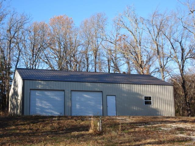 view of outbuilding with a garage