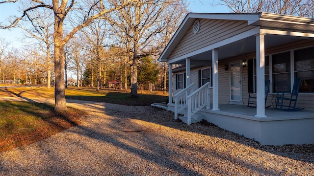 view of side of property with a porch