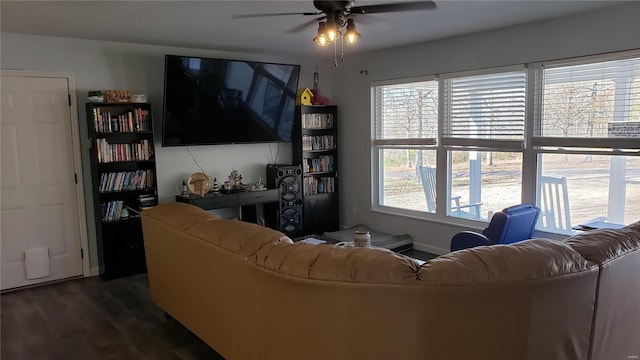 living room featuring ceiling fan, dark hardwood / wood-style flooring, and a wealth of natural light