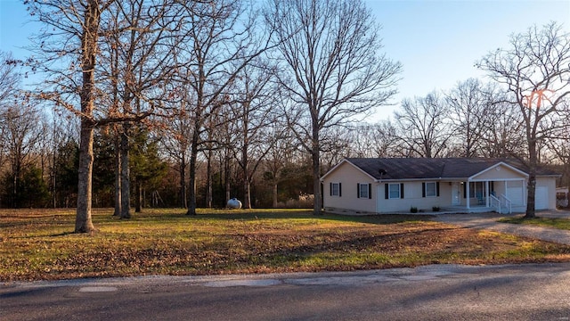 ranch-style home featuring a front yard