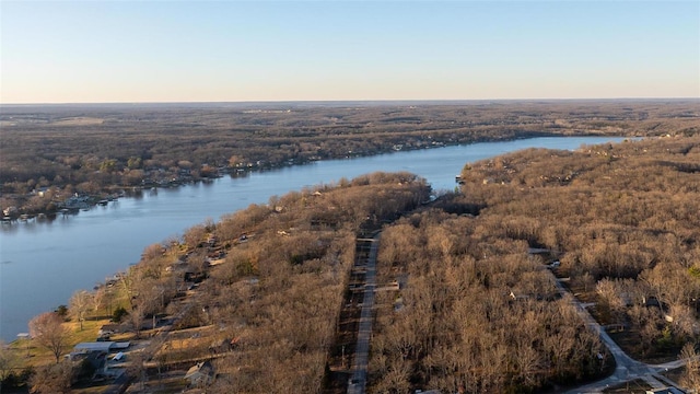 aerial view at dusk with a water view