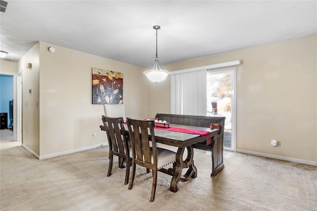 view of carpeted dining space