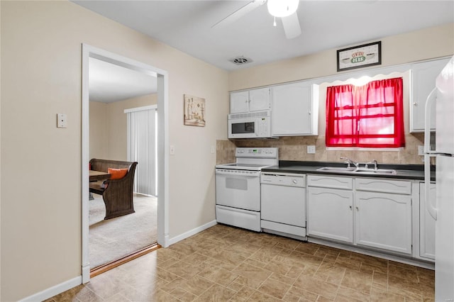 kitchen with tasteful backsplash, white appliances, ceiling fan, sink, and white cabinetry