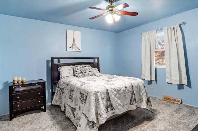 bedroom featuring light colored carpet and ceiling fan