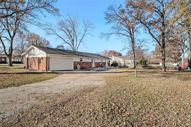 view of home's exterior featuring a lawn and a garage