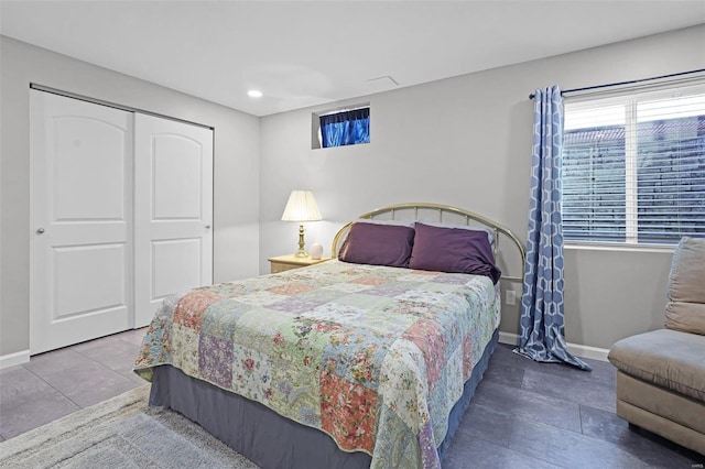 tiled bedroom featuring a closet