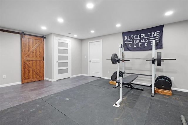 exercise area featuring a barn door