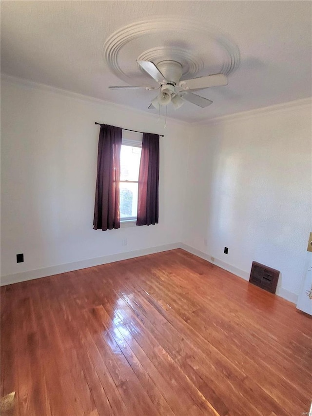 unfurnished room with crown molding, ceiling fan, and hardwood / wood-style flooring