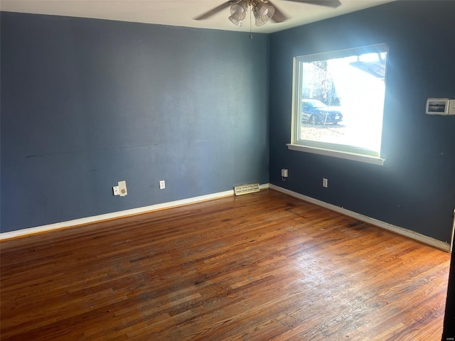 unfurnished room with hardwood / wood-style flooring and ceiling fan