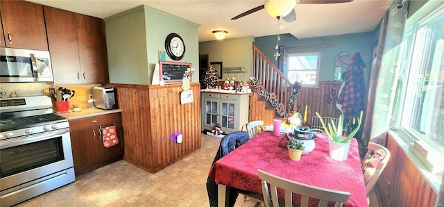 kitchen featuring tasteful backsplash, ceiling fan, and stainless steel appliances