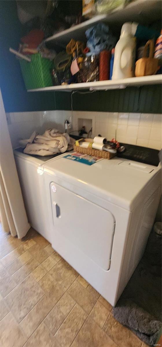 washroom with washer and clothes dryer