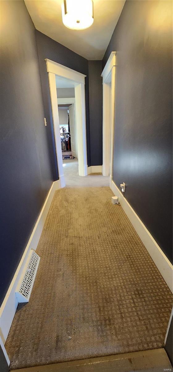 corridor featuring carpet