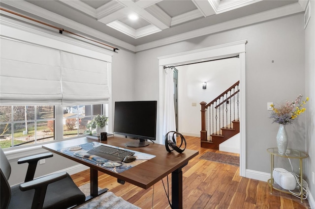 office area featuring beamed ceiling, wood-type flooring, crown molding, and coffered ceiling