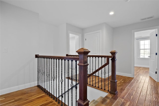 stairs featuring wood-type flooring