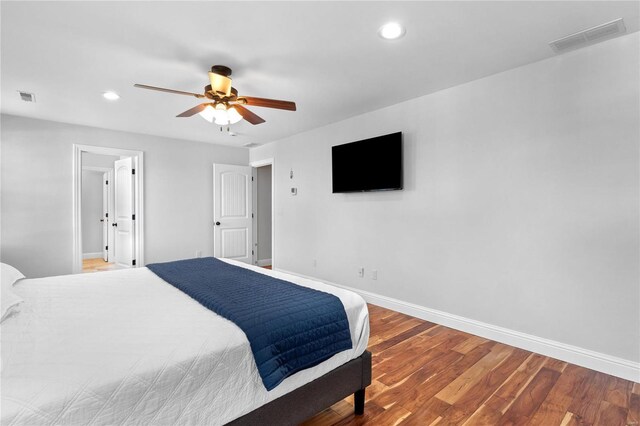 bedroom with hardwood / wood-style flooring and ceiling fan