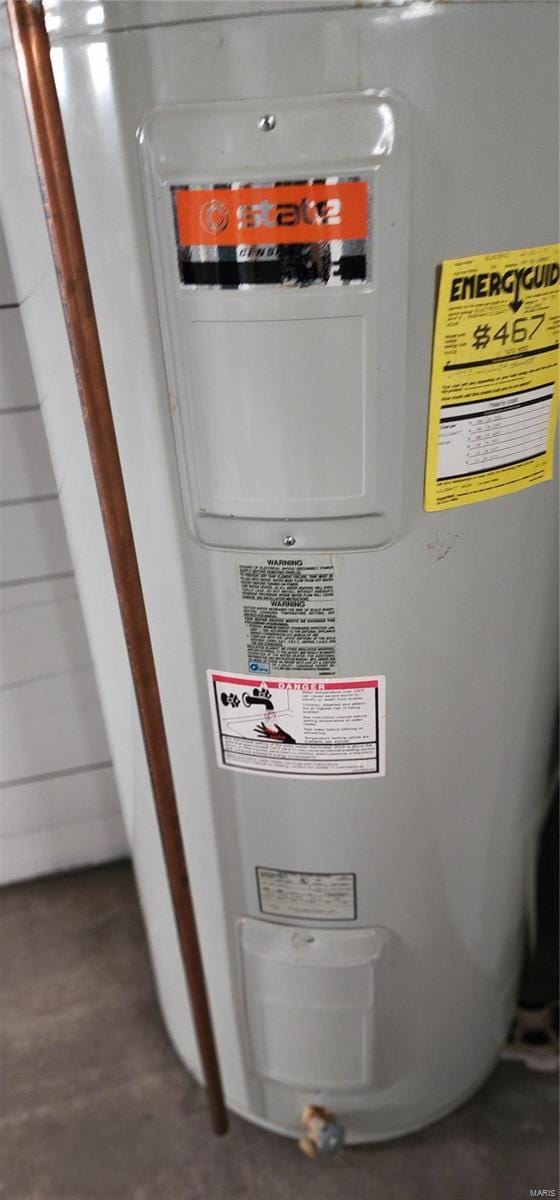 utility room featuring electric water heater