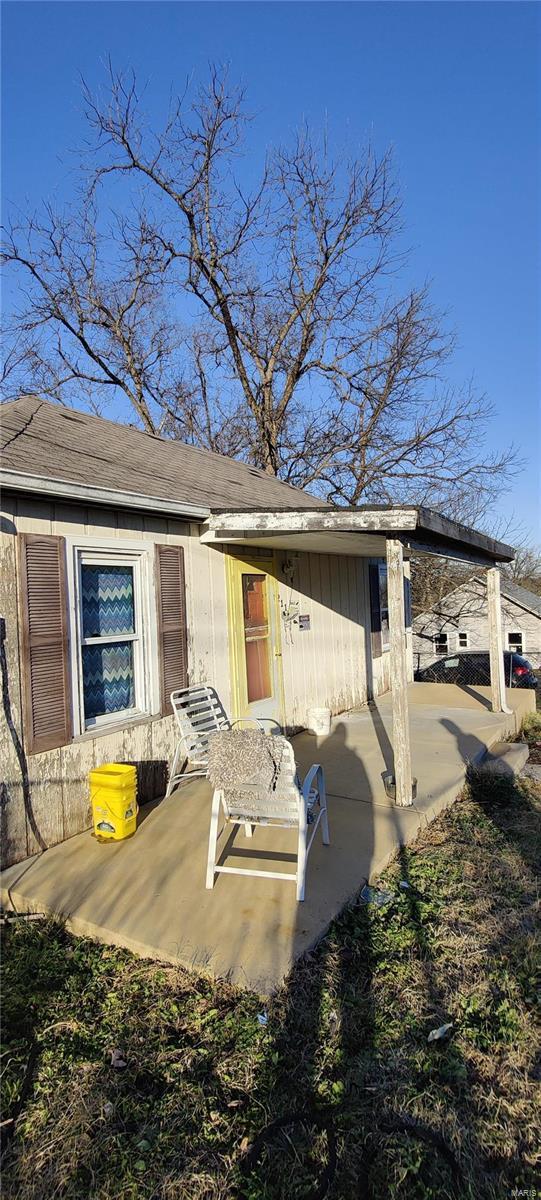 back of property featuring a patio area