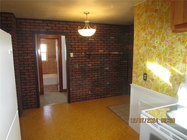 interior space featuring brick wall