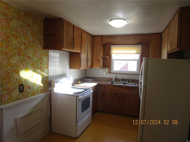 kitchen with white appliances and sink